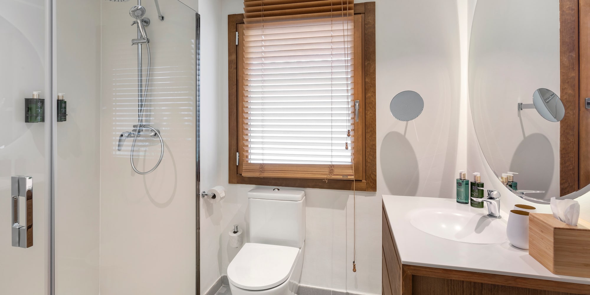 a bathroom with a shower and toilet