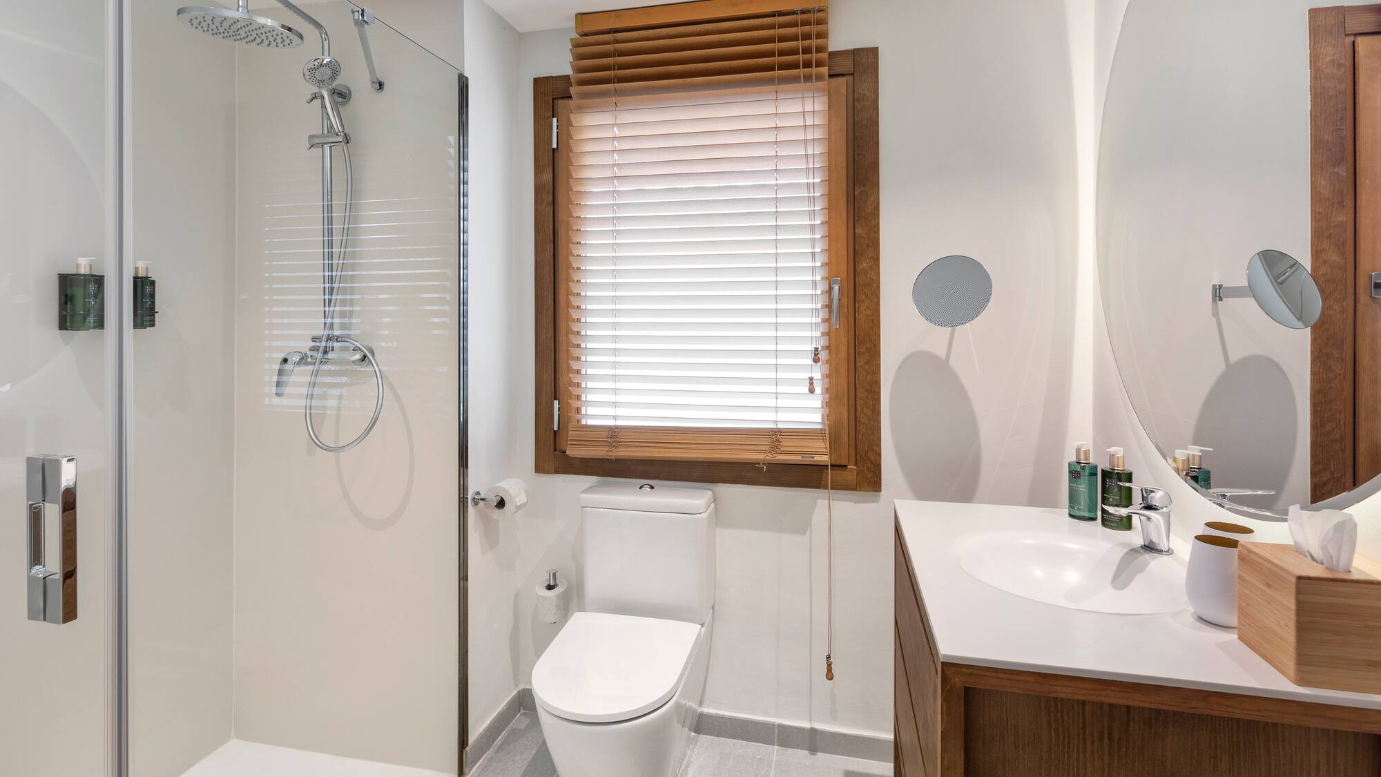 a bathroom with a shower and toilet