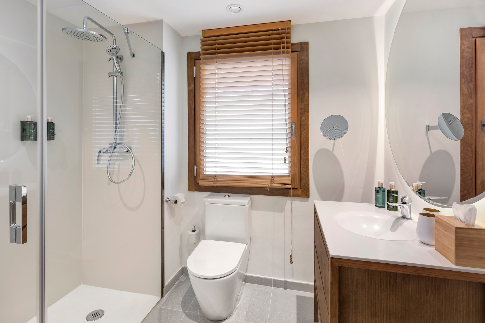 a bathroom with a shower and toilet