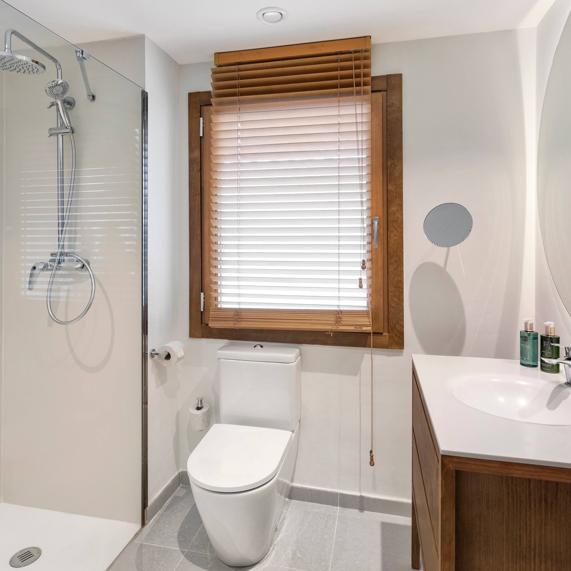 a bathroom with a shower and toilet