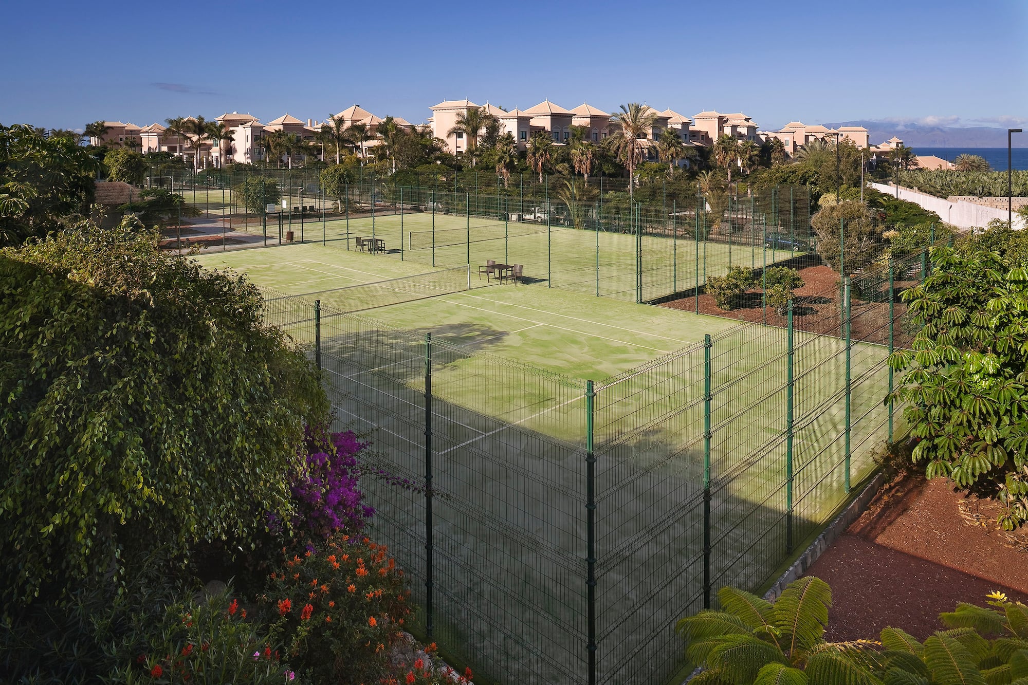 a tennis court with a fence around it