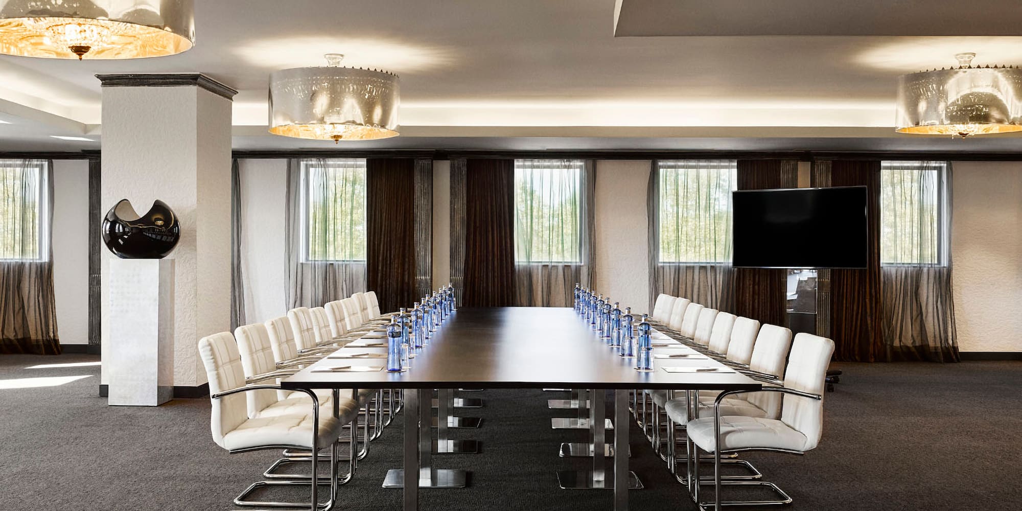 a conference room with a table and chairs