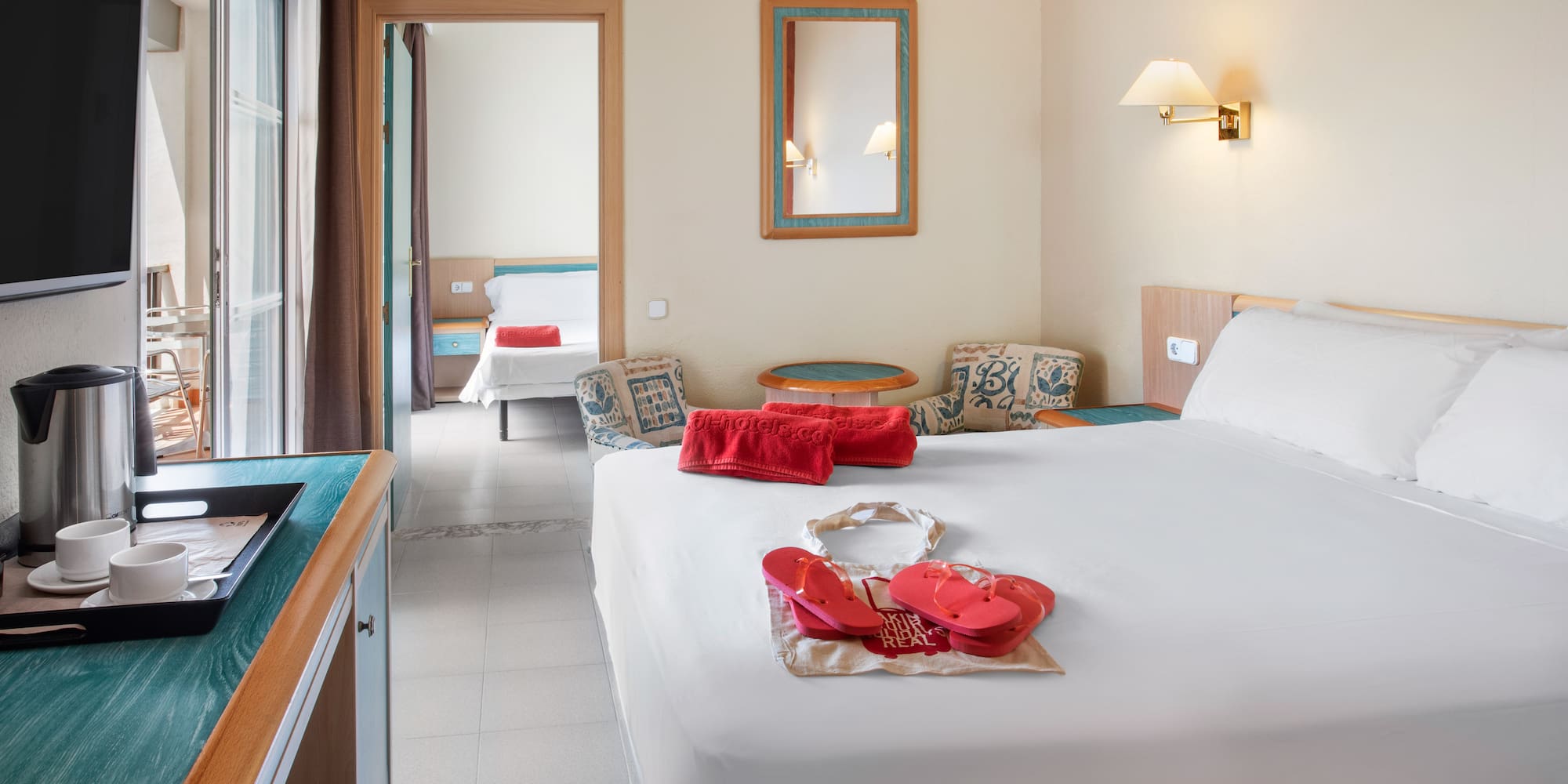 a bedroom with a bed and a towel on it