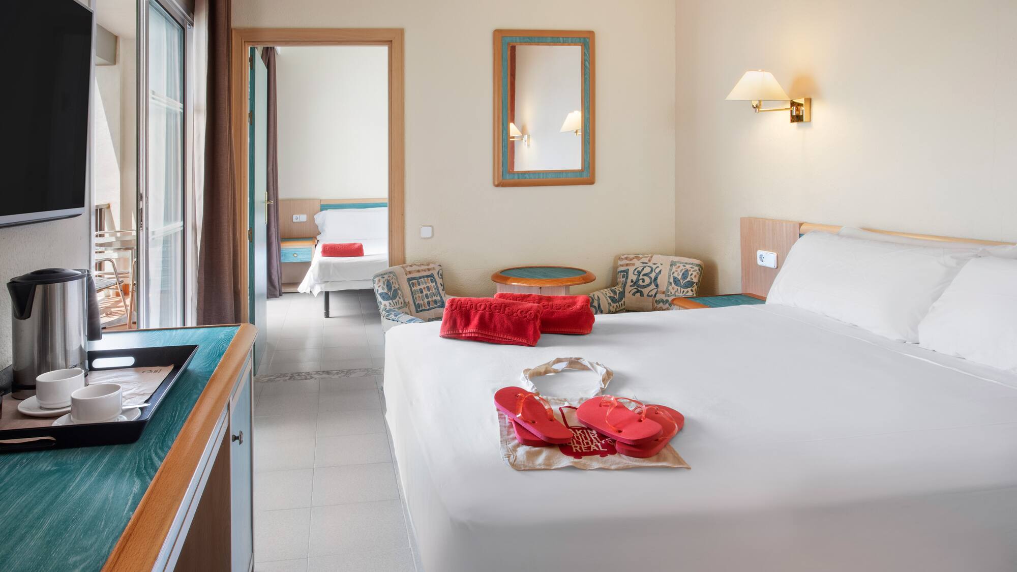 a bedroom with a bed and a towel on it