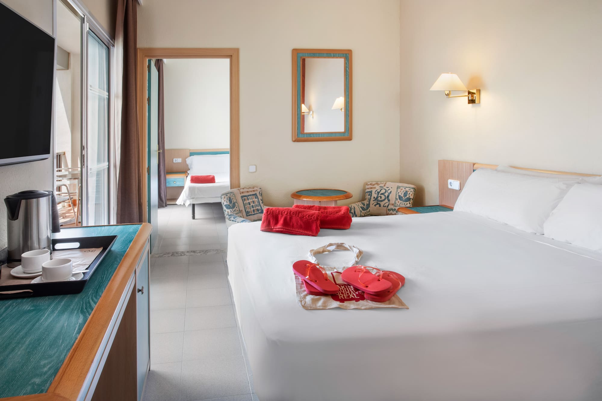 a bedroom with a bed and a towel on it