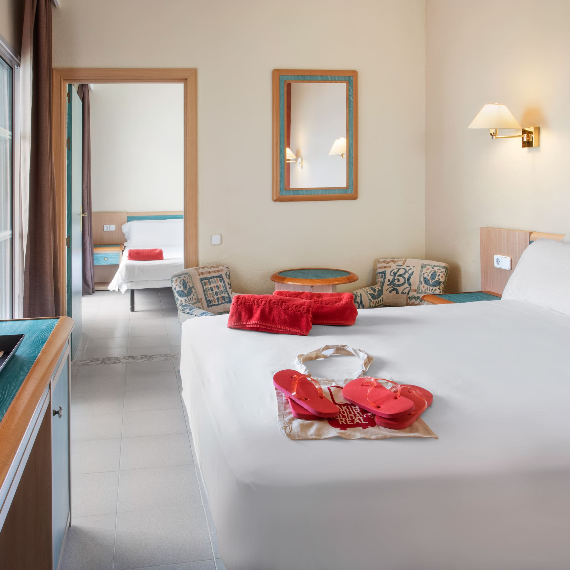 a bedroom with a bed and a towel on it