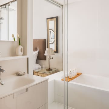 a bathroom with a bathtub and sink