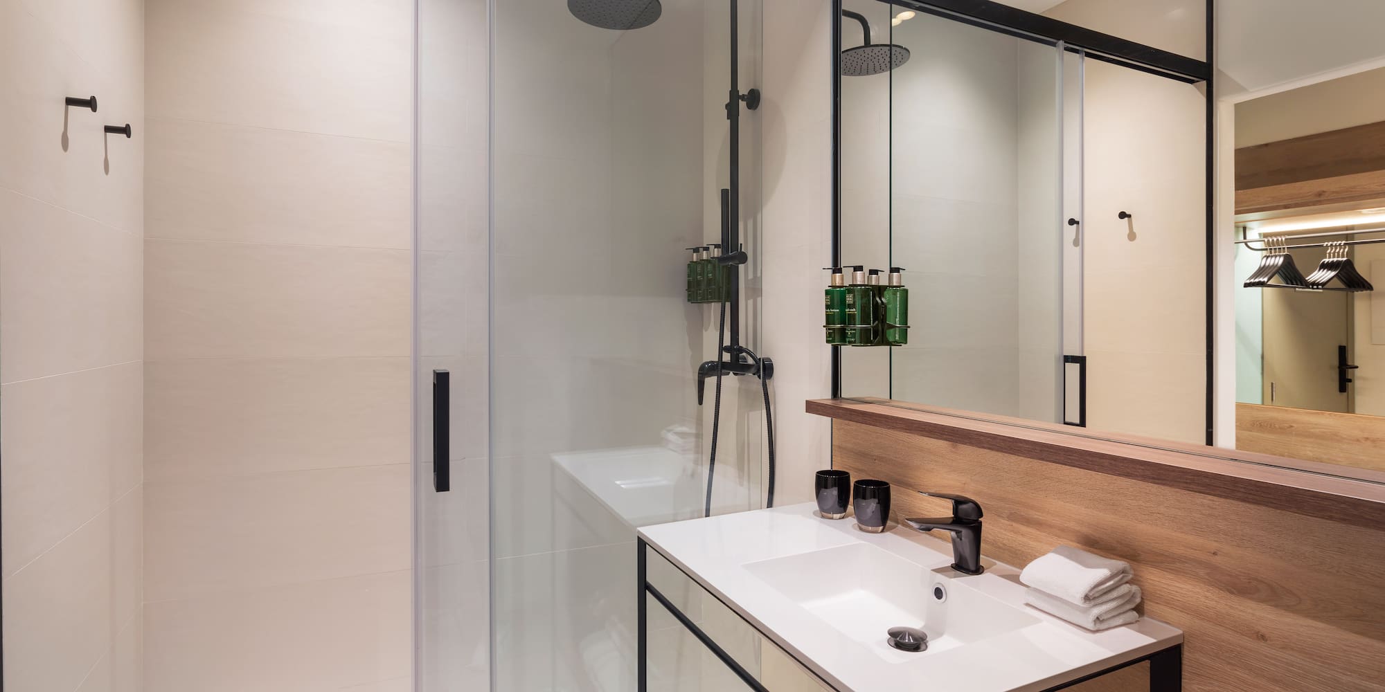 a bathroom with a shower and sink