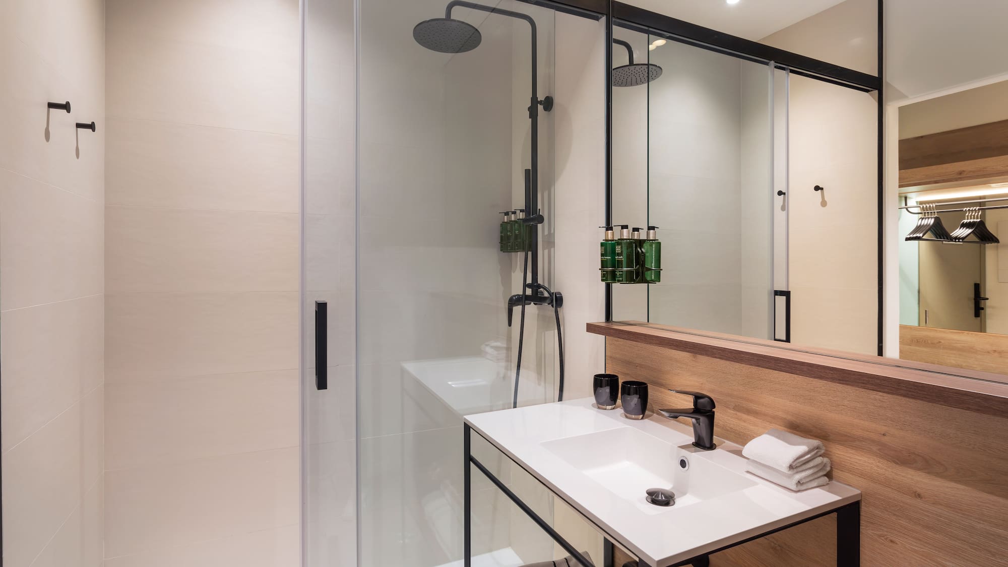 a bathroom with a shower and sink