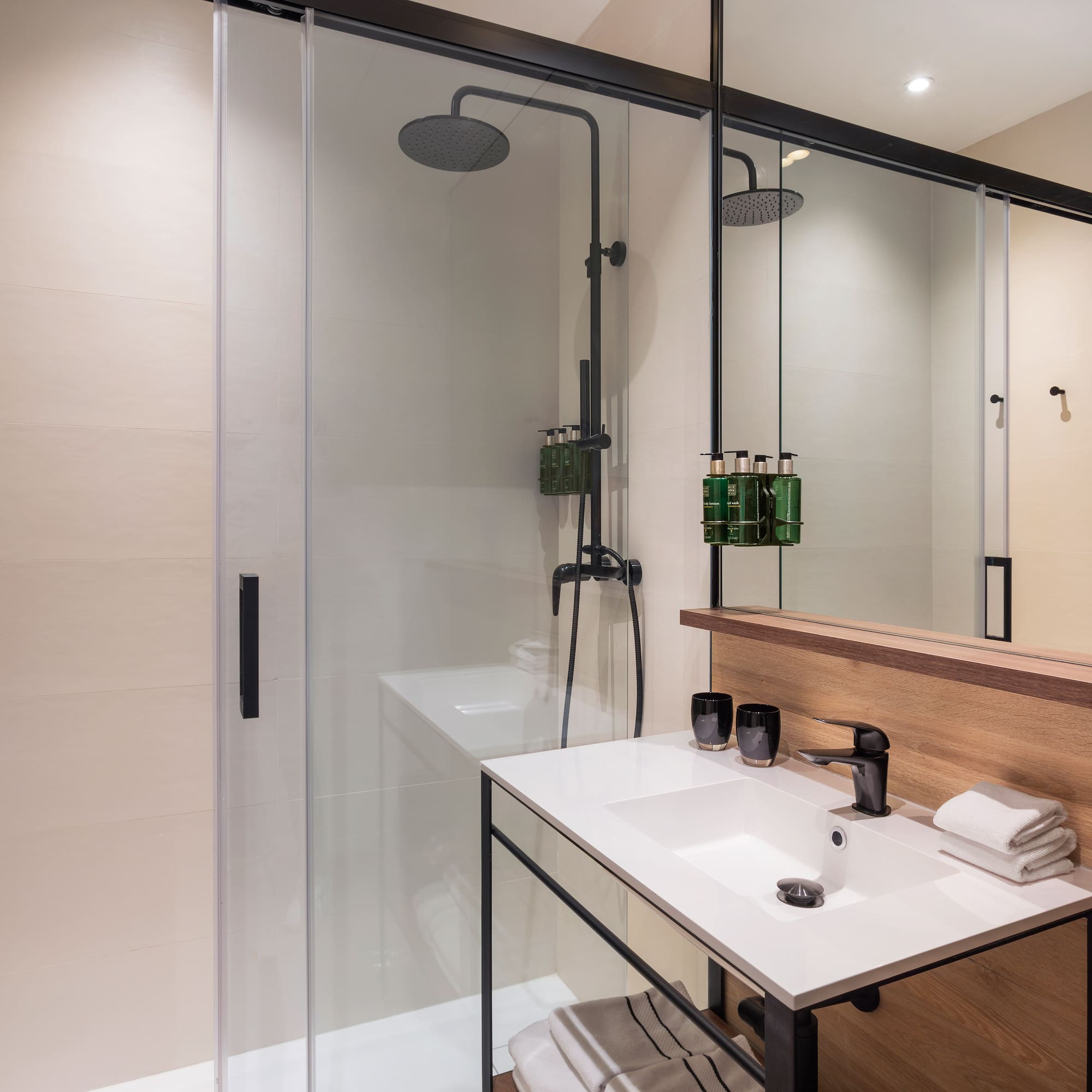 a bathroom with a shower and sink