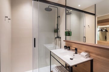 a bathroom with a shower and sink