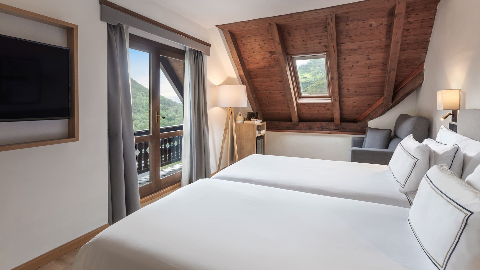 a bedroom with a wooden ceiling and a window
