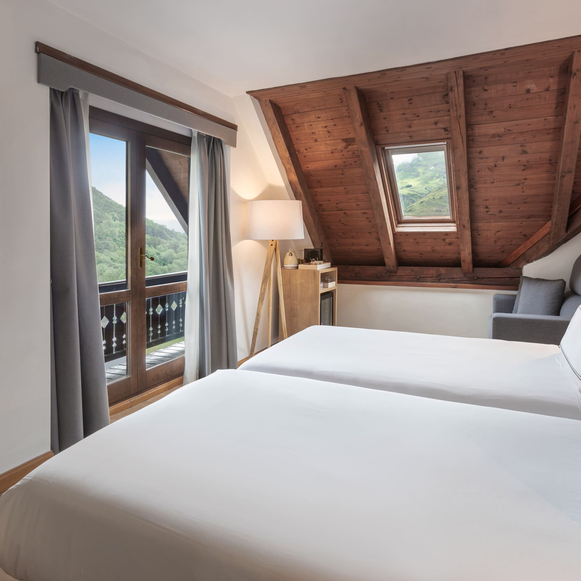 a bedroom with a wooden ceiling and a window