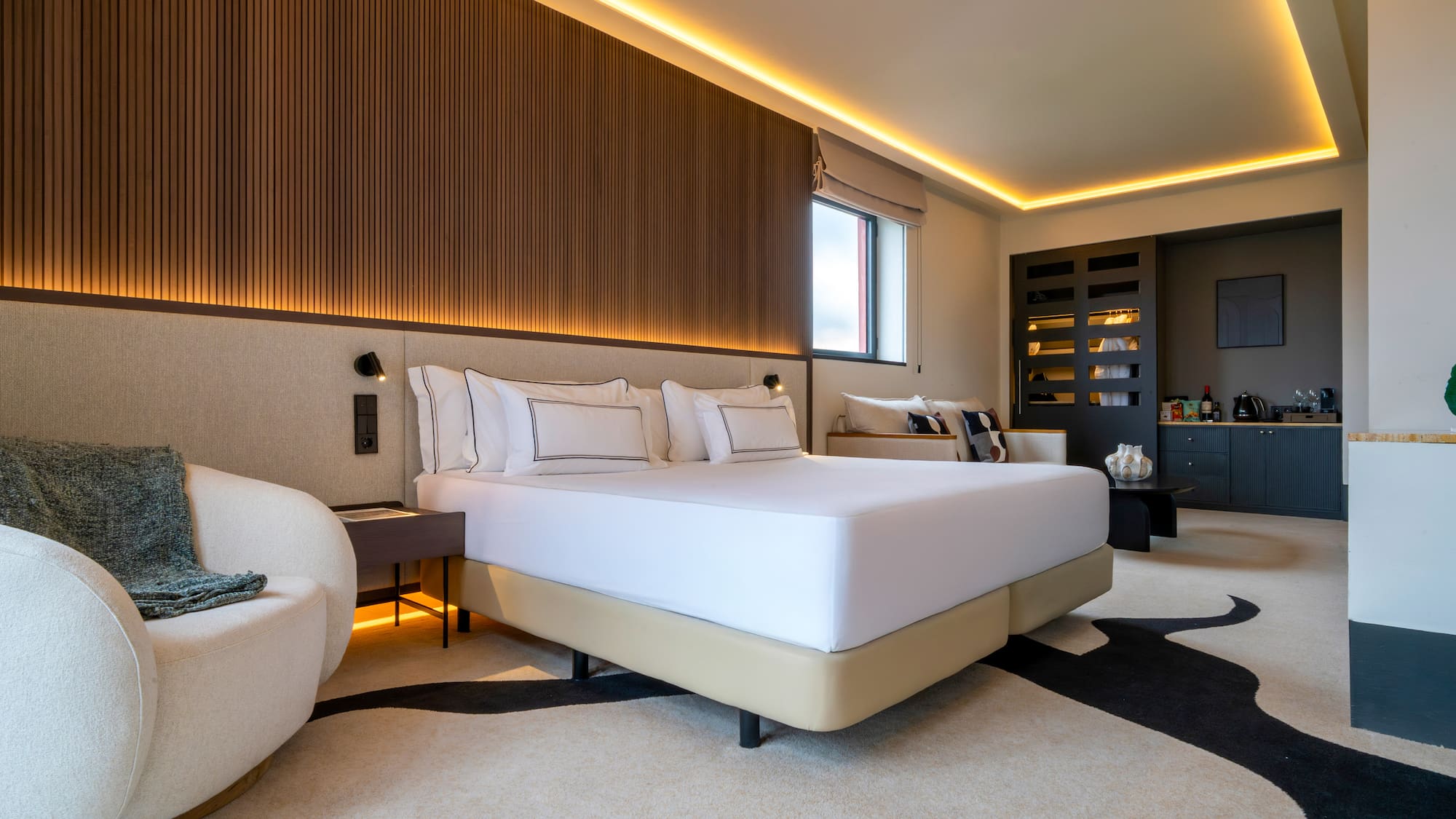 a room with a bed and a chair