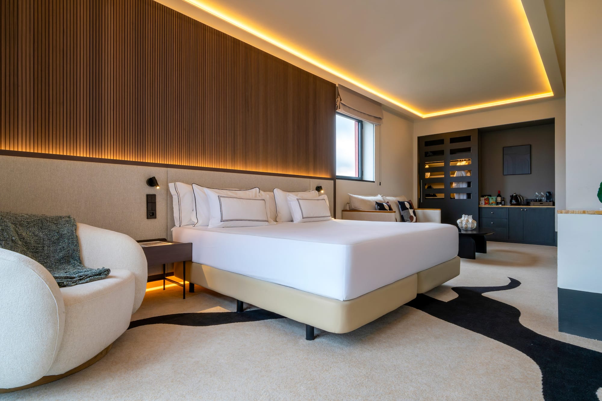 a room with a bed and a chair