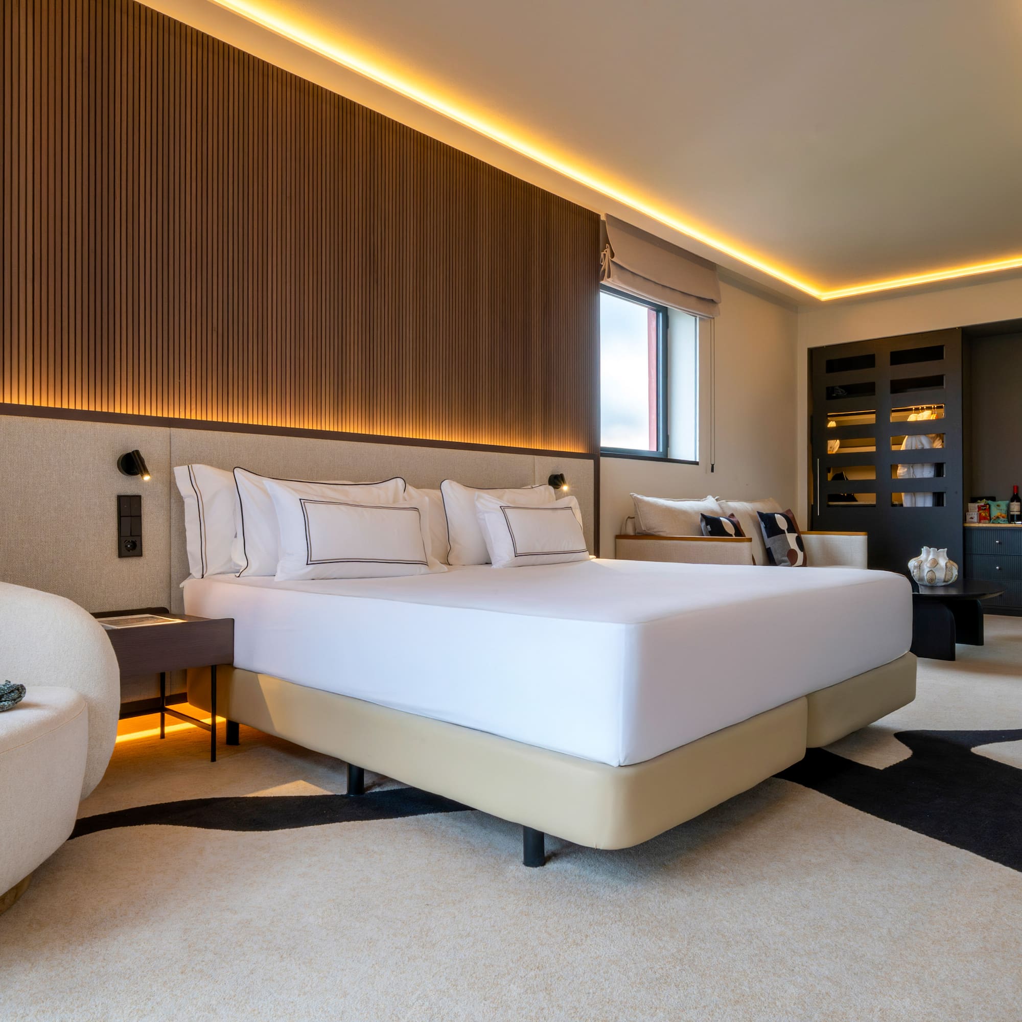 a room with a bed and a chair