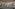 Indoor luxury spa pool with hydrotherapy features and lounge chairs.
