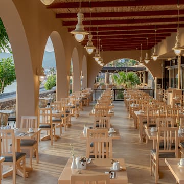a restaurant with tables and chairs