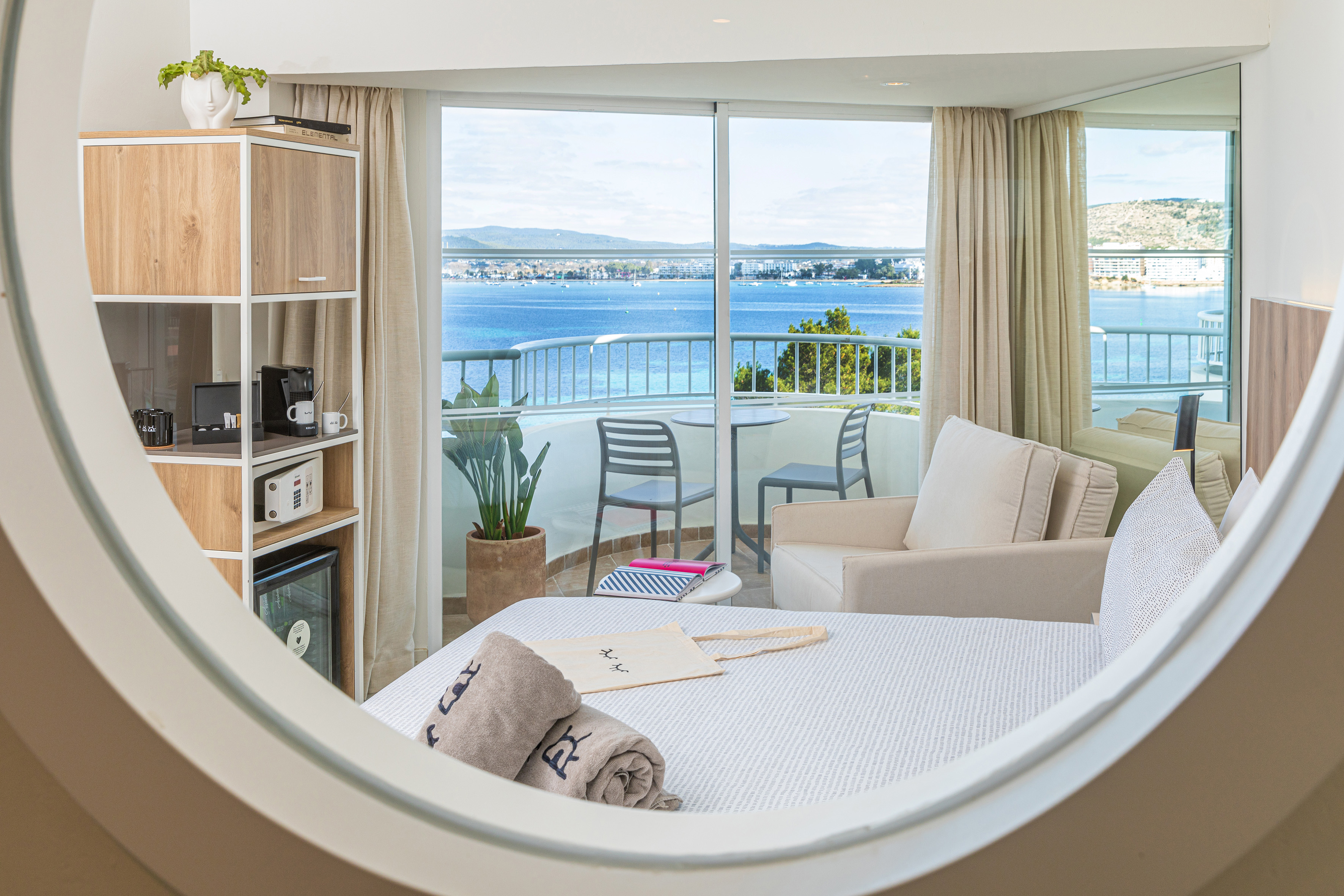 a room with a view of the ocean from a window
