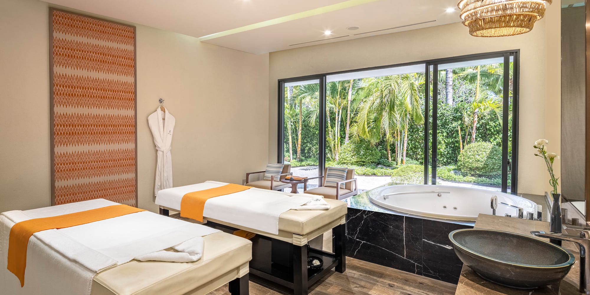 a room with beds and a hot tub