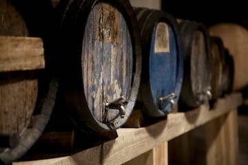 a row of barrels on a shelf