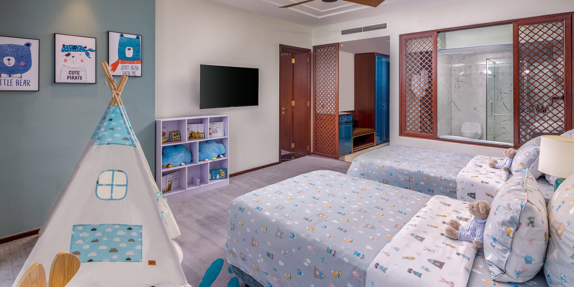 a room with two beds and a teepee