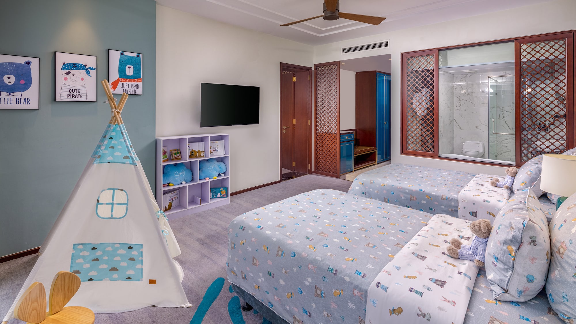 a room with two beds and a teepee