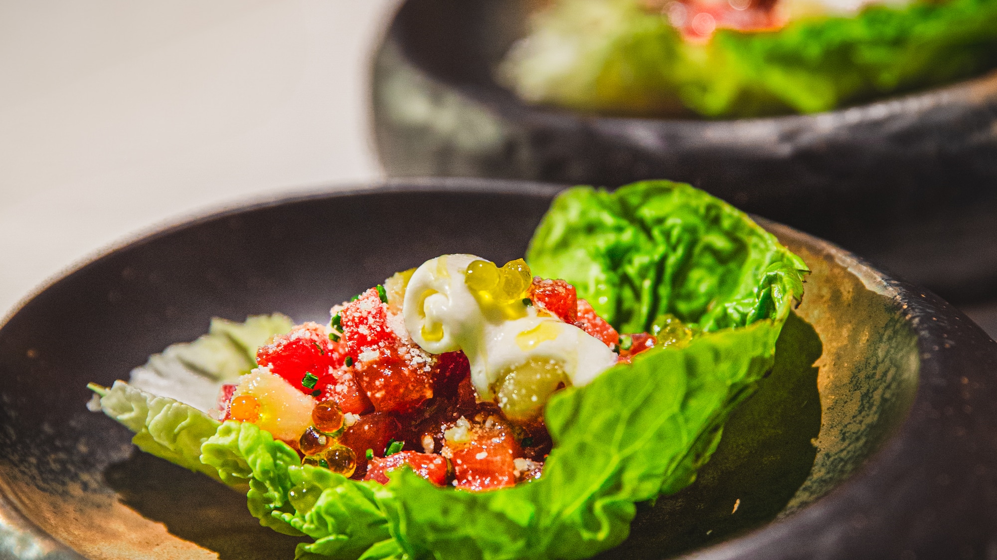a bowl of lettuce with food in it