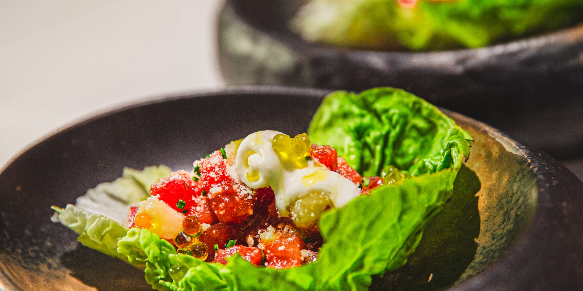 a bowl of lettuce with food in it