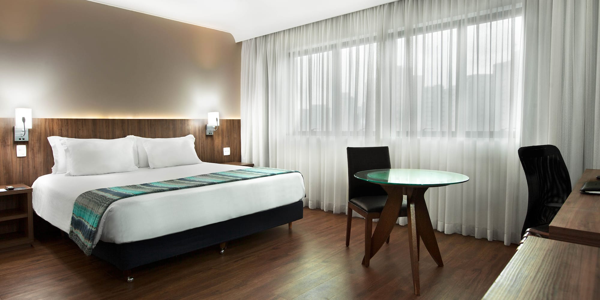 a room with a bed and a table