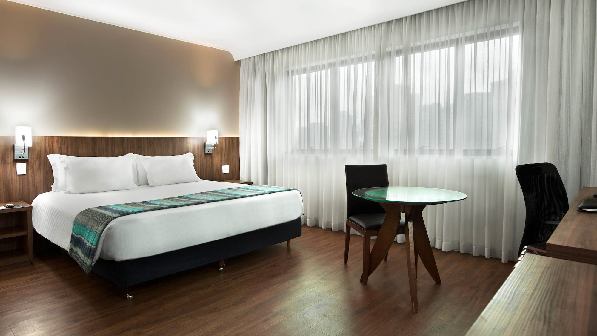 a room with a bed and a table