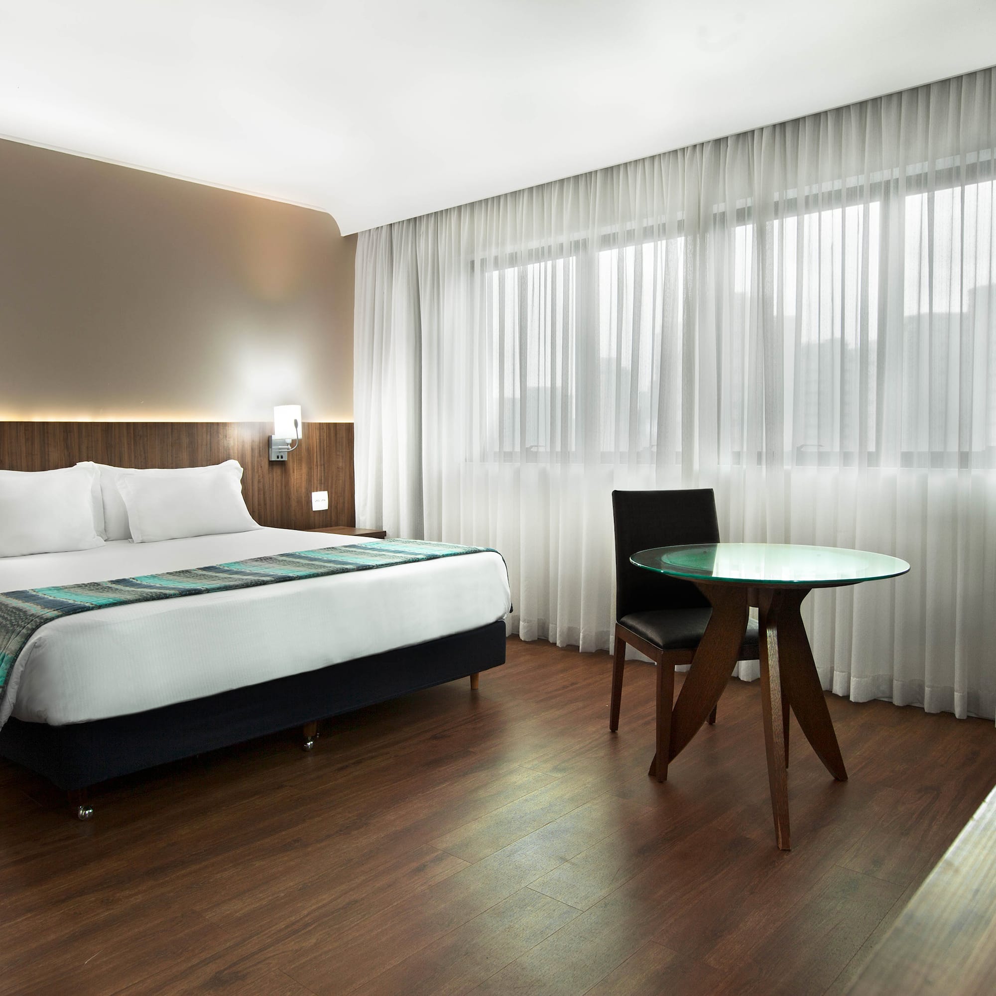 a room with a bed and a table