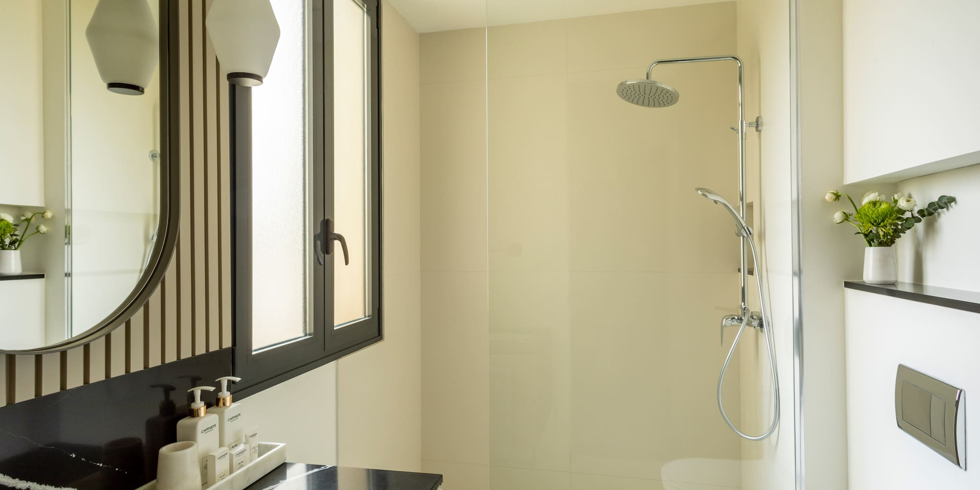 a bathroom with a shower and sink