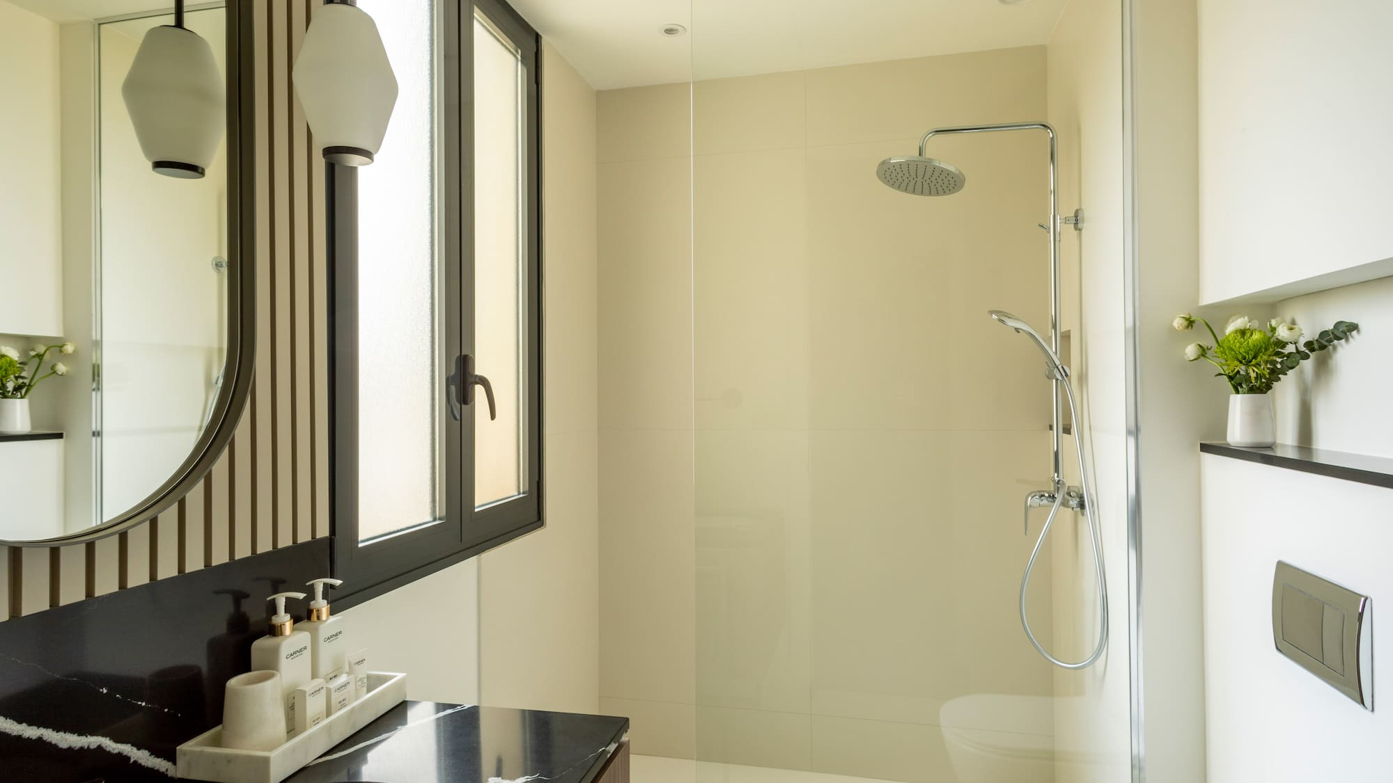 a bathroom with a shower and sink