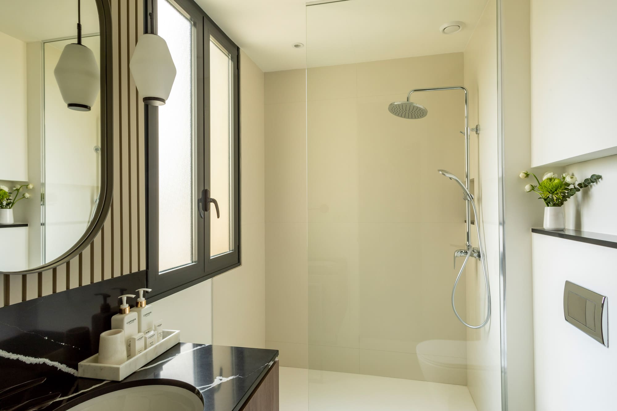 a bathroom with a shower and sink