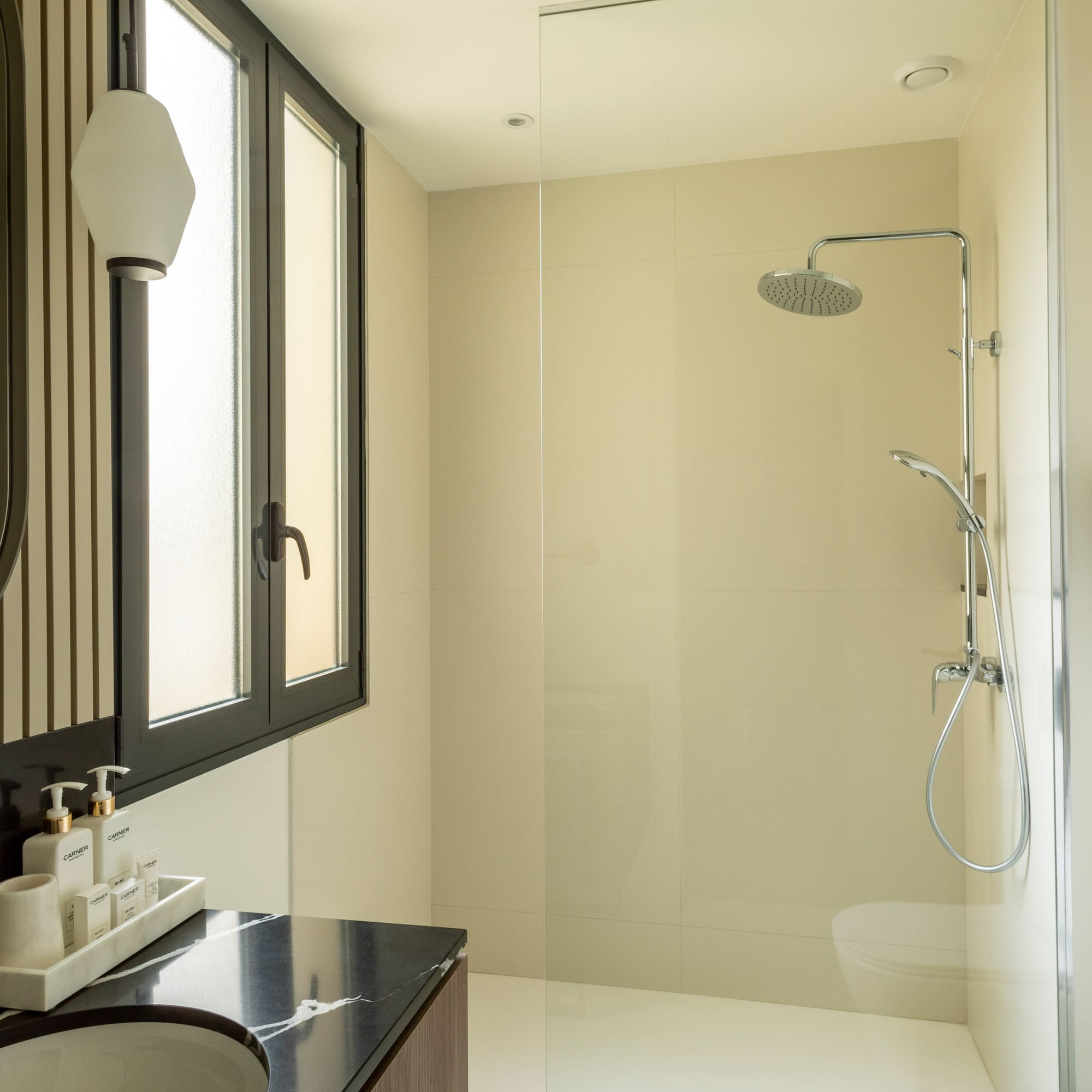 a bathroom with a shower and sink