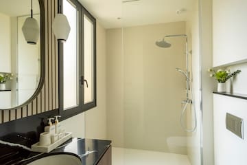 a bathroom with a shower and sink