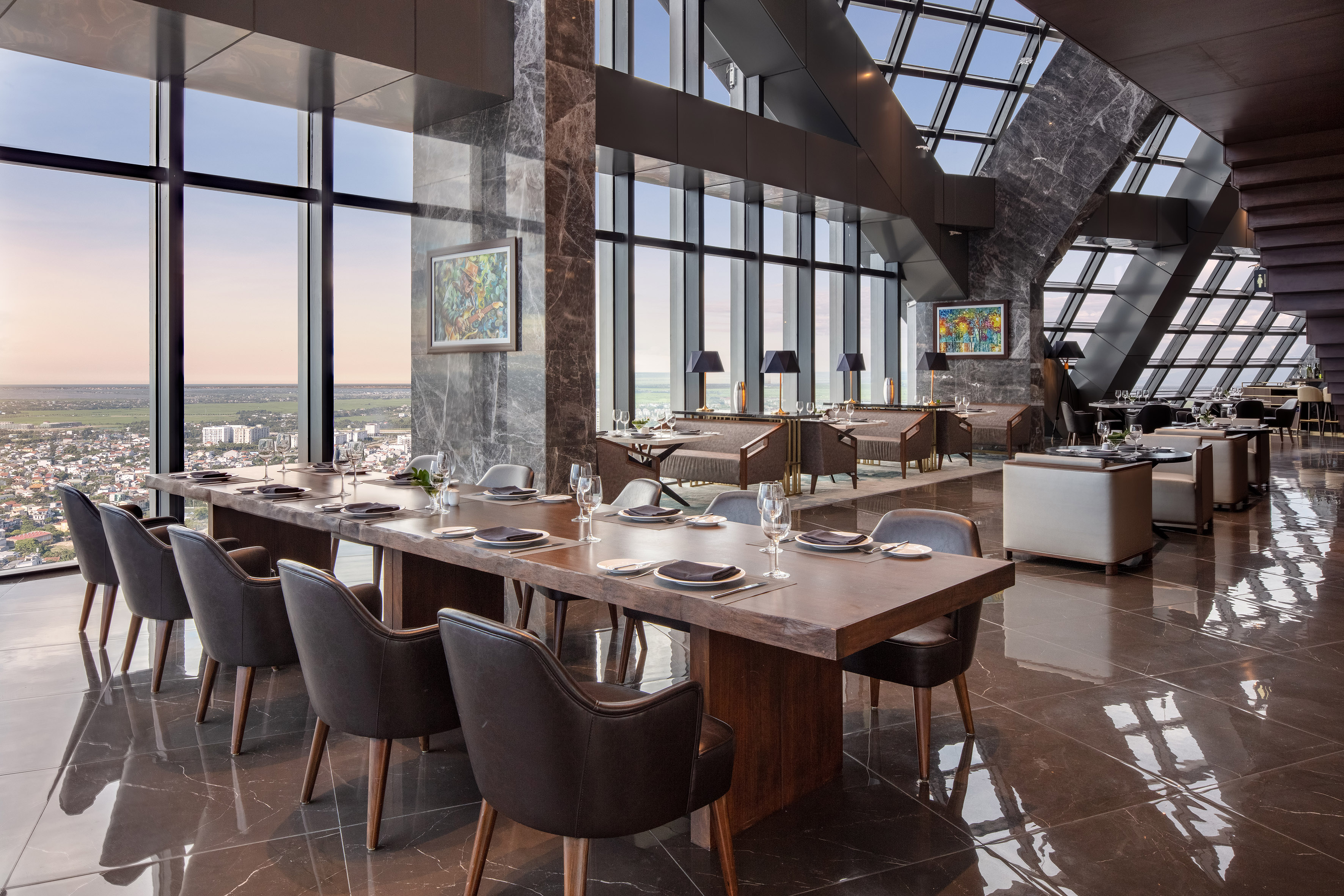 Modern luxury restaurant interior with panoramic city view.