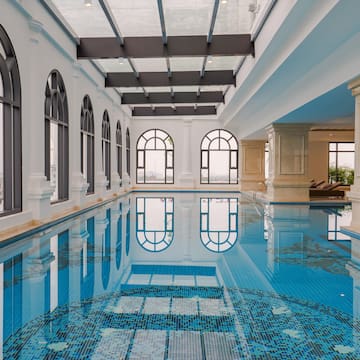 a indoor swimming pool with arched windows