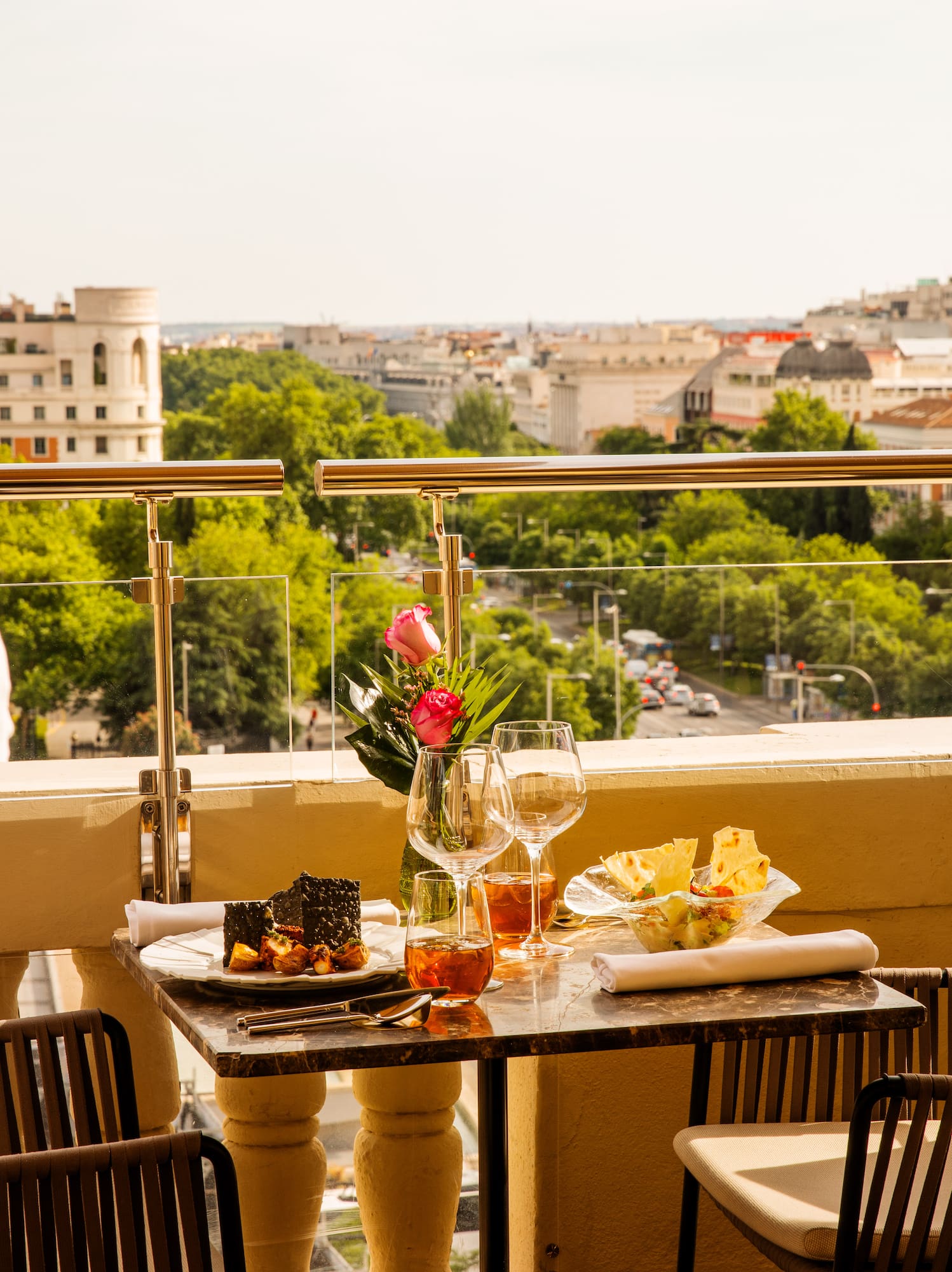a table with food and wine glasses on it