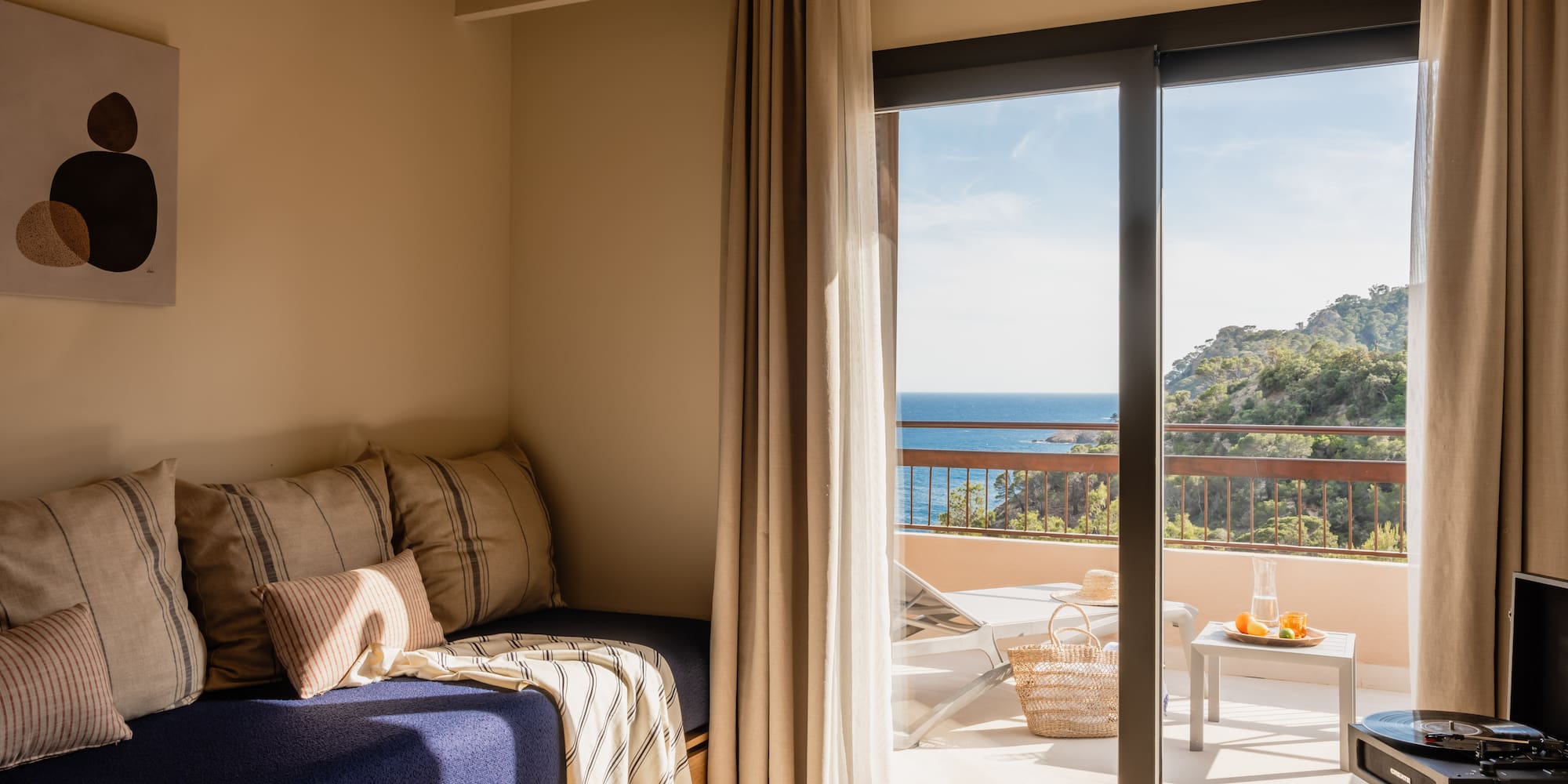 a room with a bed and glass doors