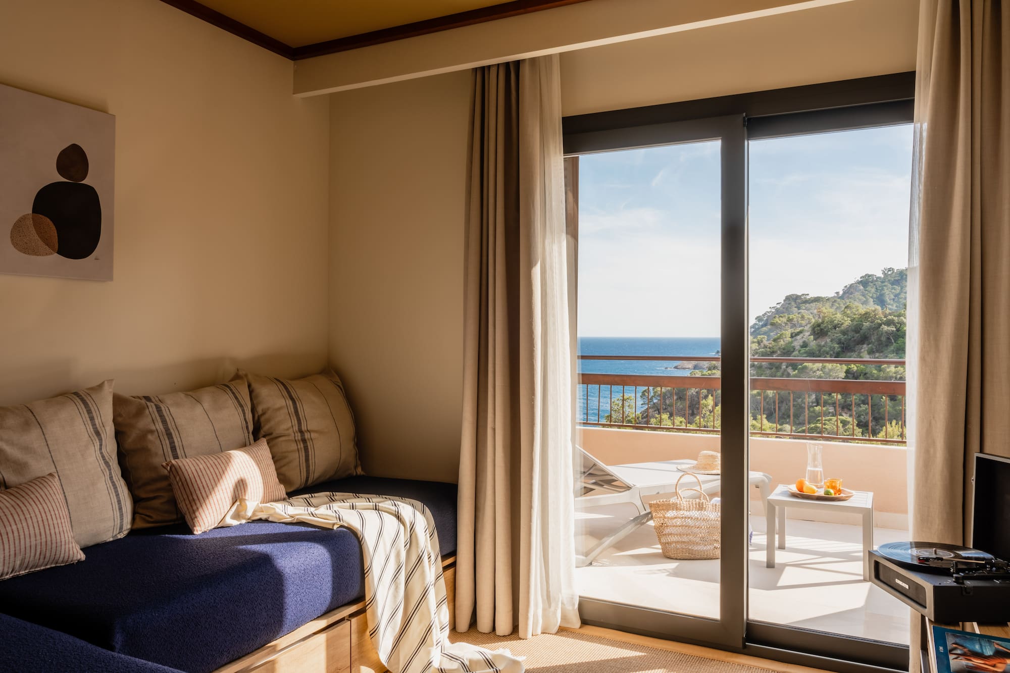 a room with a bed and glass doors