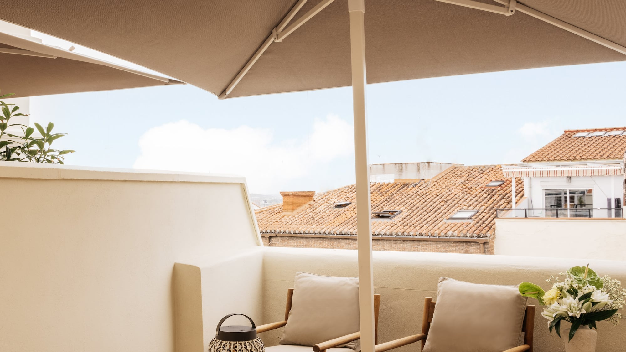 a patio with a table and chairs