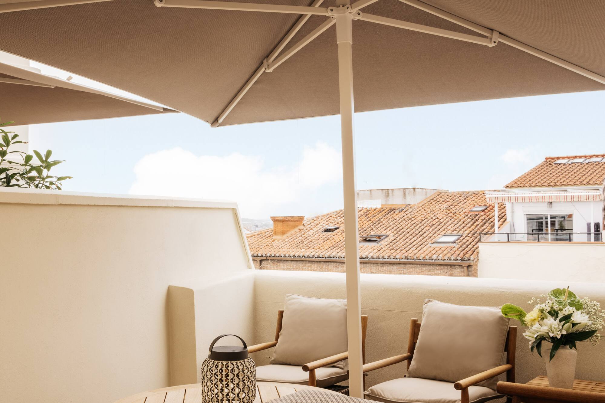 a patio with a table and chairs