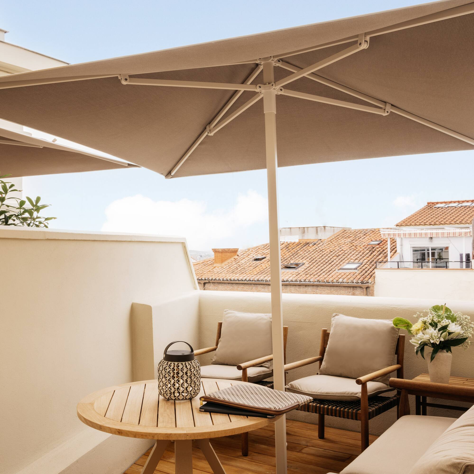 a patio with a table and chairs