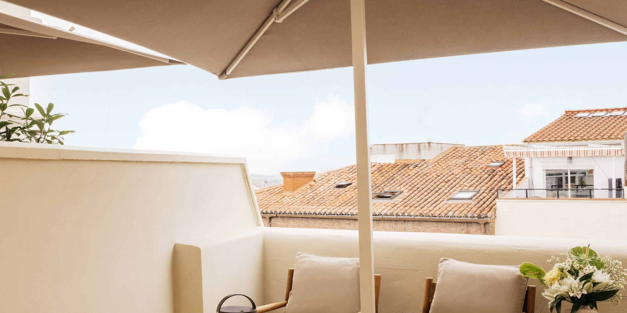 a patio with a table and chairs