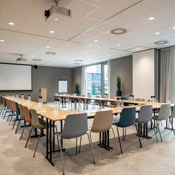 a room with a large table and chairs