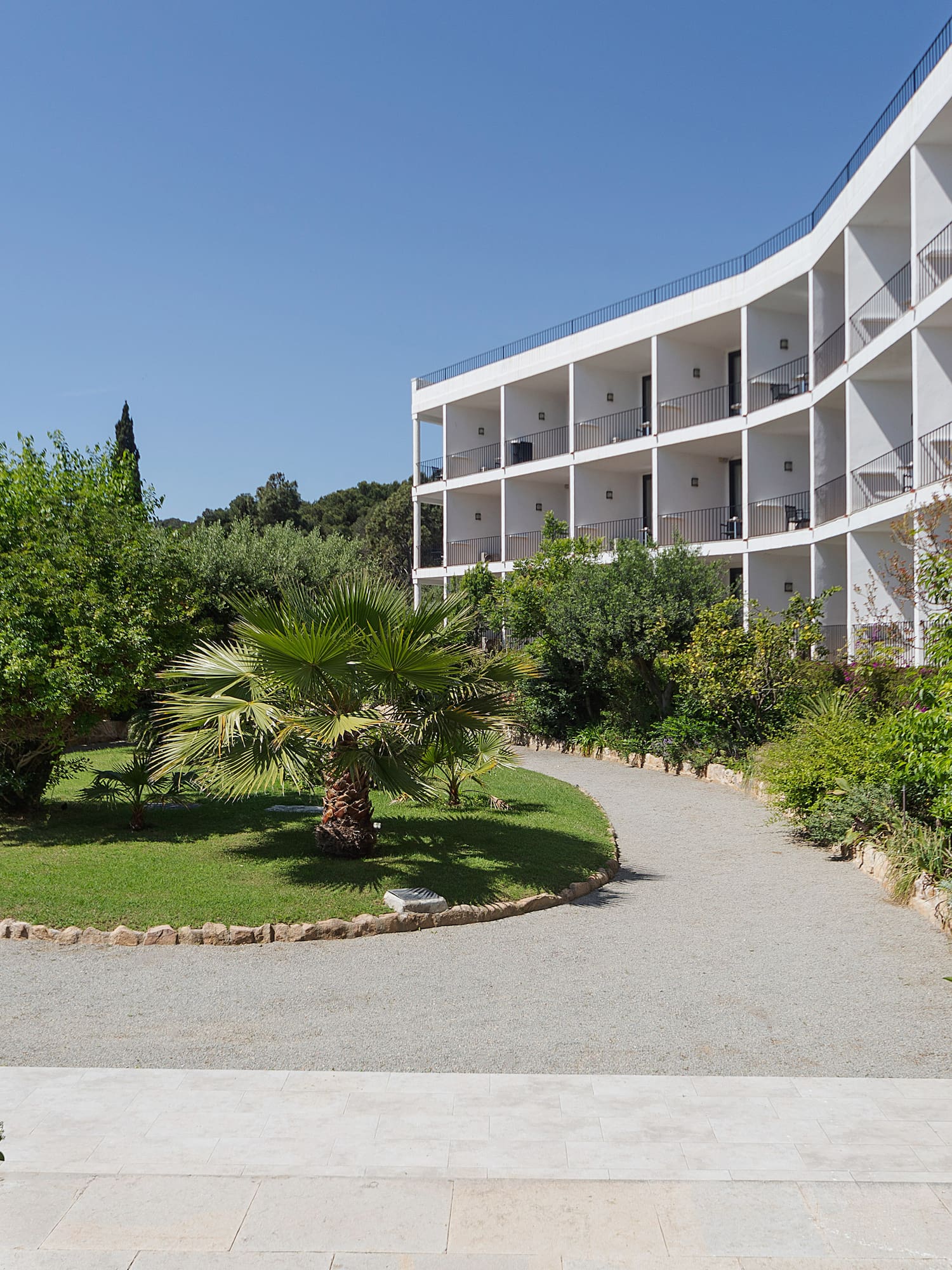 a building with trees and bushes