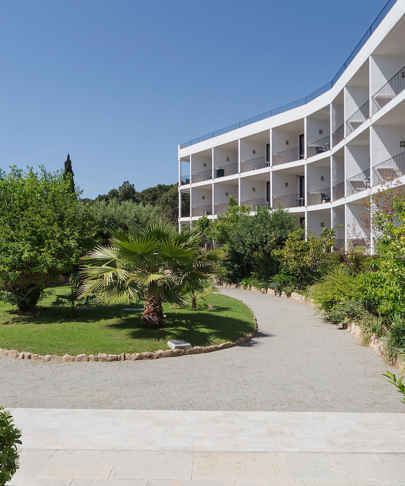 a building with trees and bushes