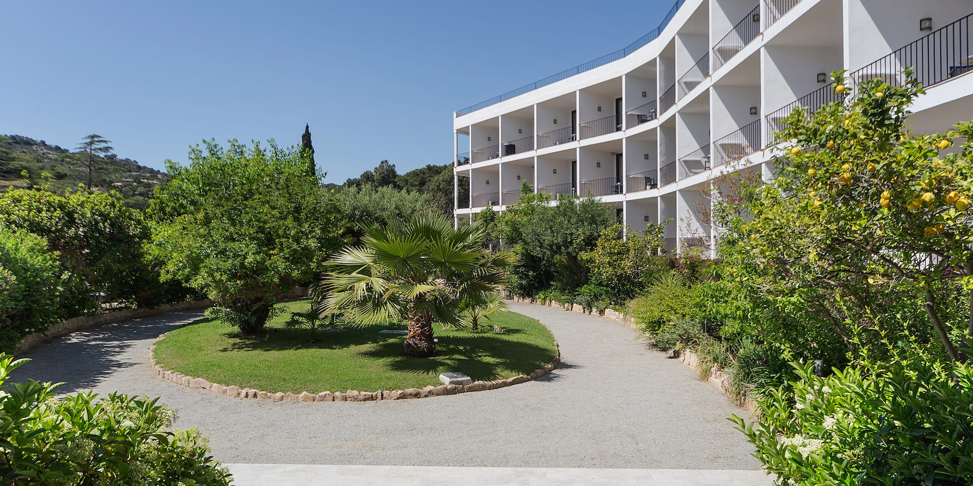 a building with trees and bushes